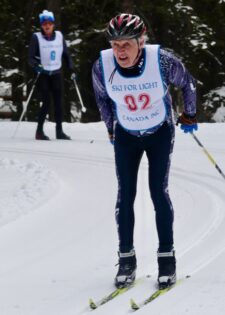 Photo of Jerry skiing on the race course.